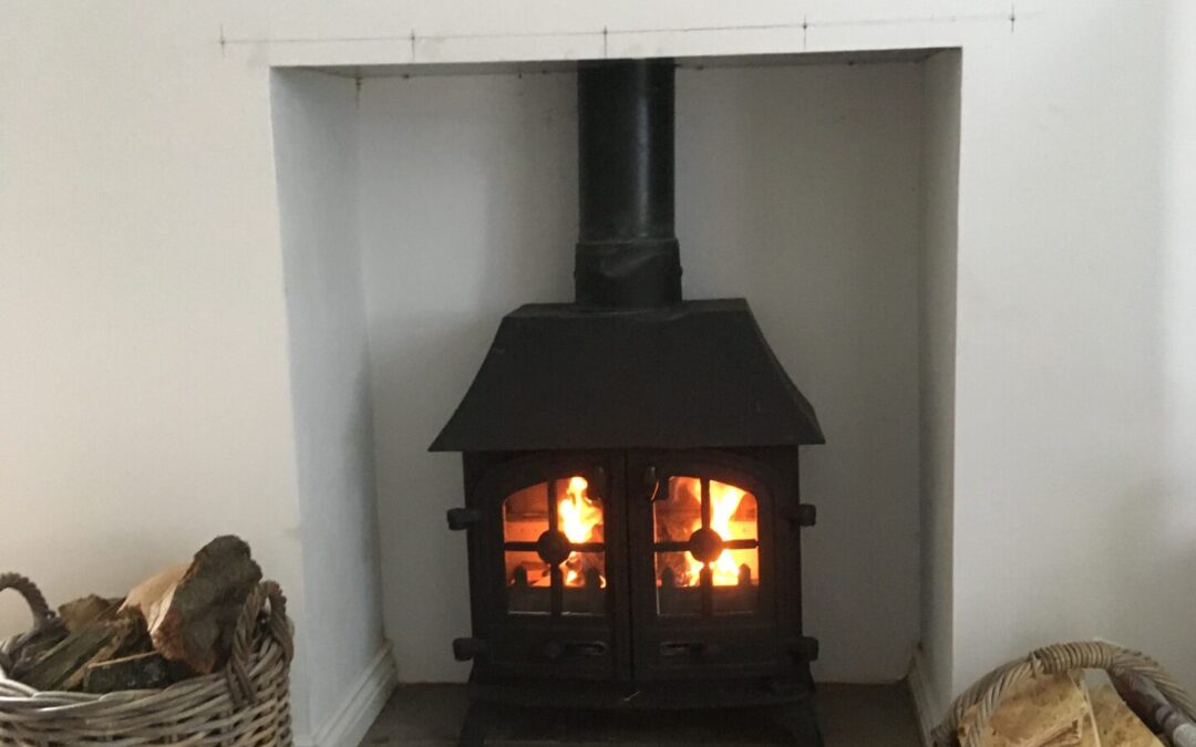 Mel Thomas' fireplace with Log And Kindling baskets